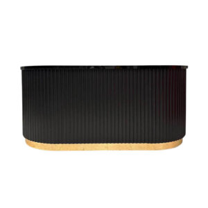 A black cocktail bar with gold trim at the bottom