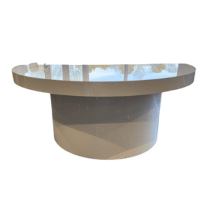 A circular, sleek modern table that is flat on one side to sit flush with a wall