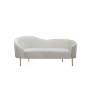An oblong white fabric couch with gold feet