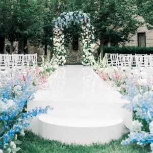 Wedding ceremony aisle with floral arch